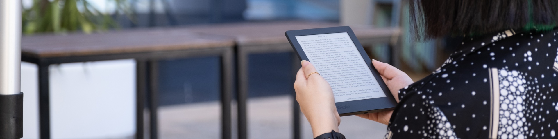 Person reading eBook on eReader