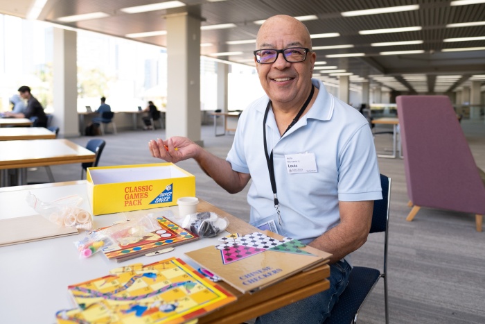 Volunteer in the State Librarys board game area