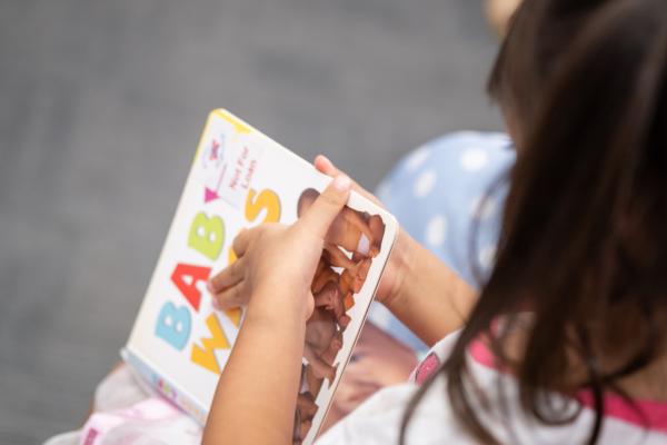 Child reading Baby Ways at Better Beginnings Rhyme Time session