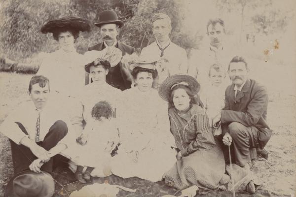  Charles Walker photographs himself with a group kneeling at far right with camera cord in his hand ca1905