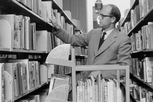 Arthur Ellis in Circulation Services selecting an exchange of books to be despatched to a library 1964