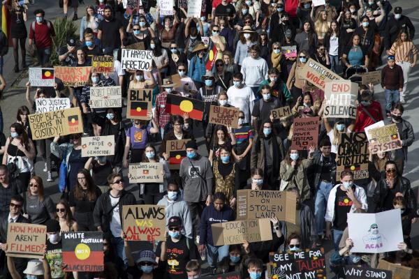 Protesters march along Wellington Street in front of the Perth Rail Station during the 3rd Black Lives Matter rally on 4th July 2020