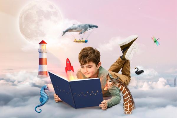 2023 Premiers Reading Challenge hero image boy reading book in the sky