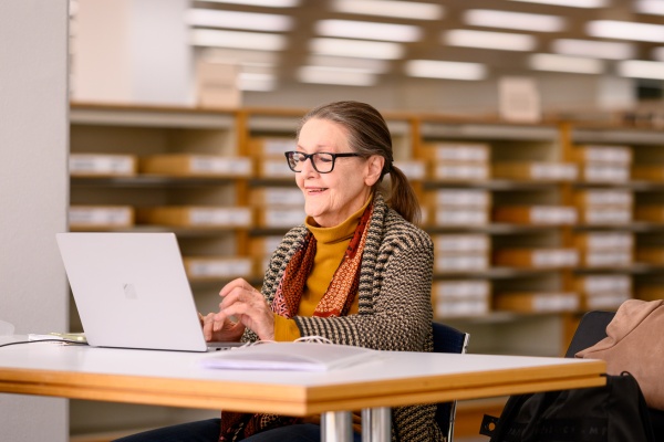 Person on laptop inside the Library