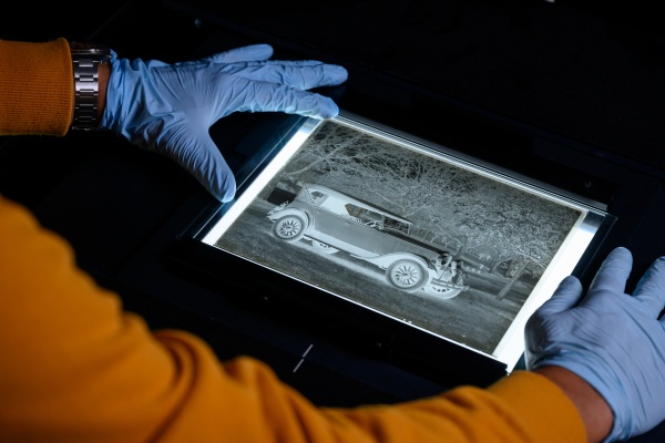 Scanning and digitising an old photograph negative in the preservation lab