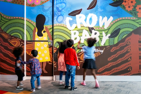 Children looking at the Crow Baby exhibition in the Story Place Gallery