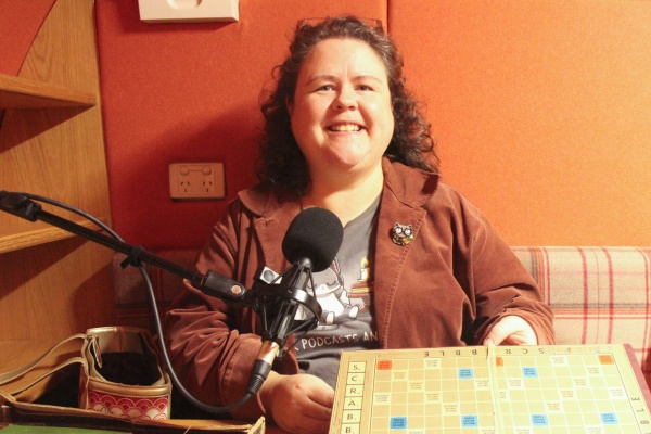 Amber Blake holding her familys Scrabble Board