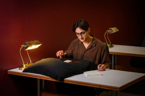 A person examining a collection item