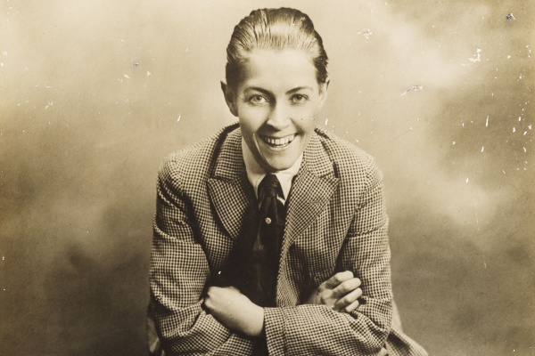 Studio portrait of Effie Fellows dressed in a knickerbocker suit