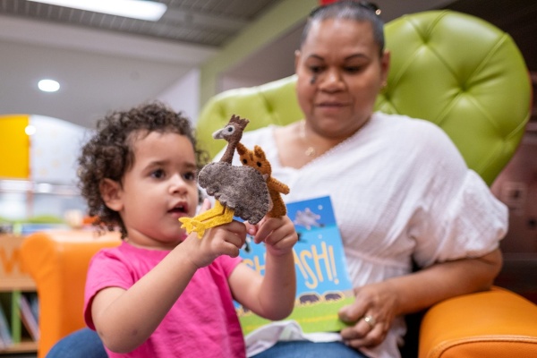 Playing with an animals toys in The Story Place