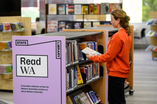 Person looking at Read WA Collection