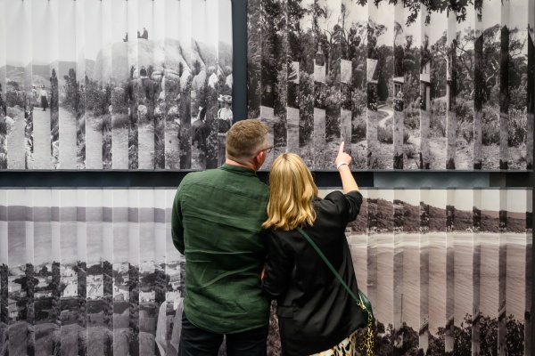Image of two people attending an exhibition