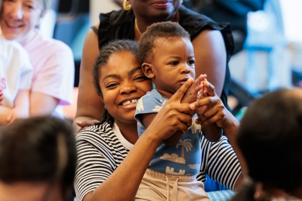 Mom and baby enjoying Rhyme Time at Ruth Faulkner Library