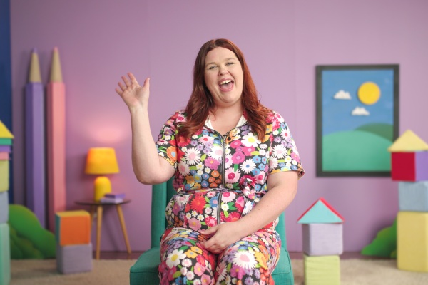 Woman waving to camera