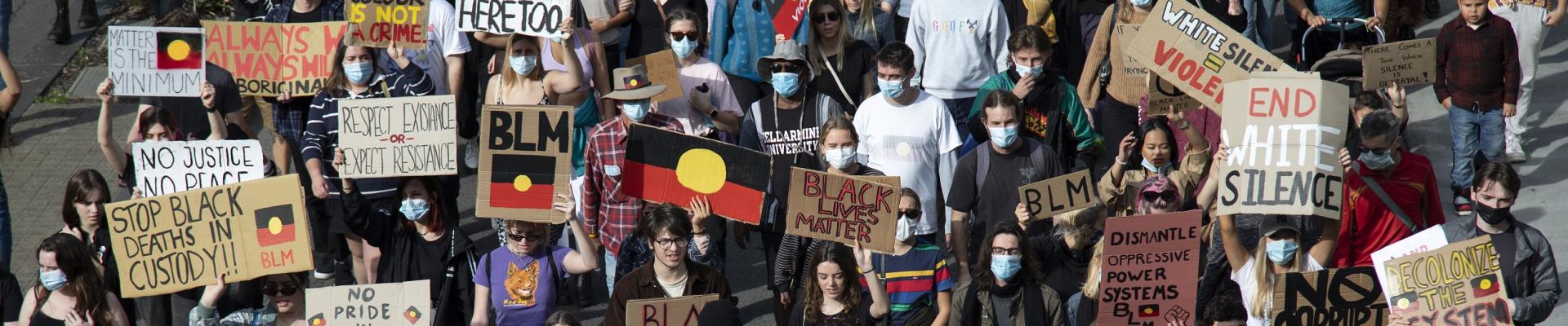 Protesters march along Wellington Street in front of the Perth Rail Station during the 3rd Black Lives Matter rally on 4th July 2020