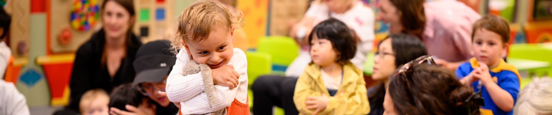 Story Time with child hugging toy