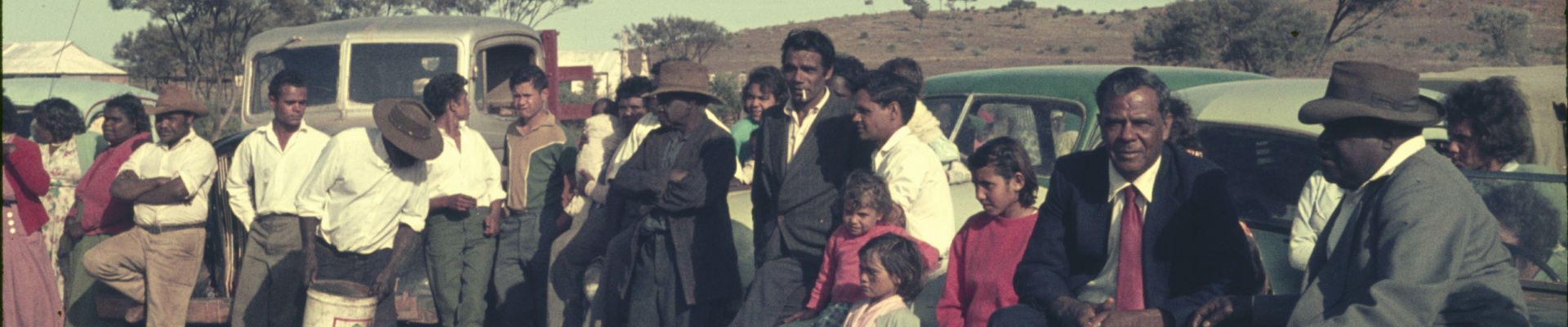 Families attend a camp service Mt Margaret Mission with singing and the message in language ca1950