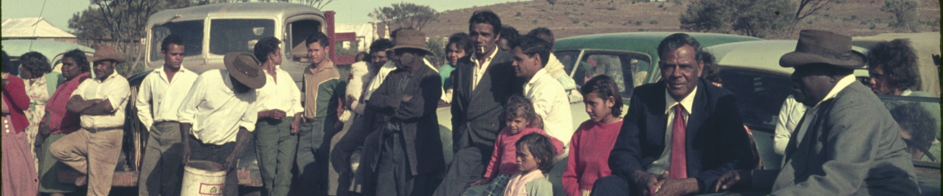 Families attend a camp service Mt Margaret Mission with singing and the message in language ca1950