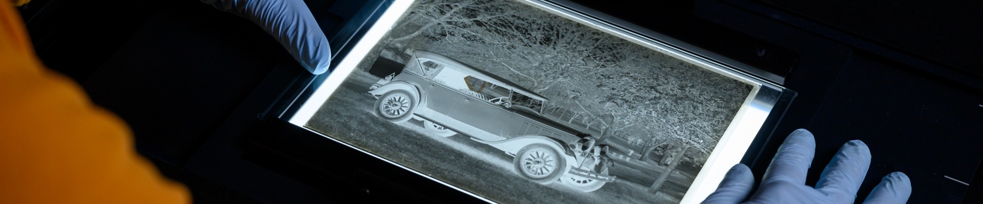 Scanning and digitising an old photograph negative in the preservation lab