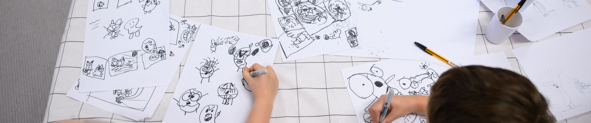 Drawing at a comic book workshop with Aka
