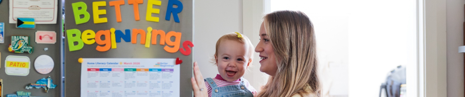 Mum and baby looking in fridge