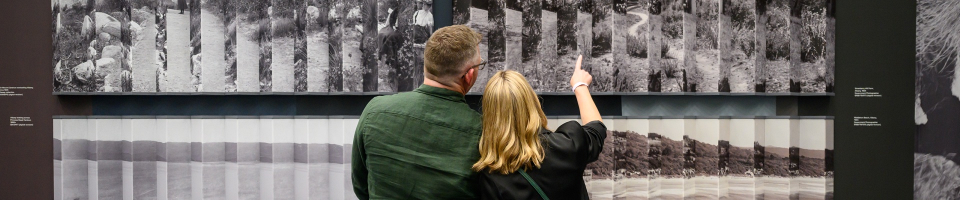 Image of two people attending an exhibition