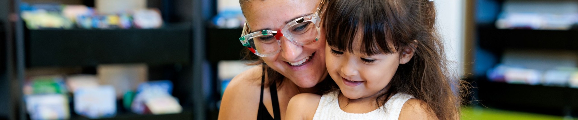 Mother and child looking at book at the Ruth Faulkner Library in Belmont 2026