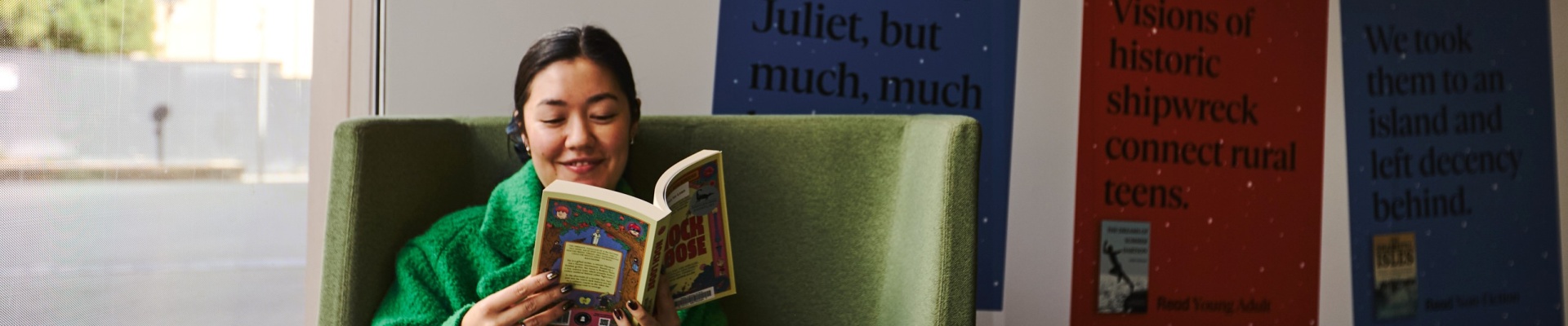 Wowan reading book by window
