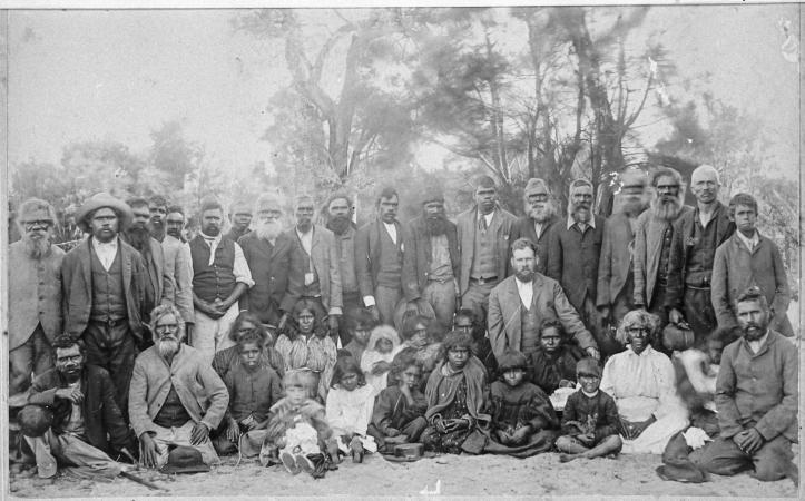 Group portrait of Noongar men women and children Fanny Balbuk sitting front row second from right Before 1907