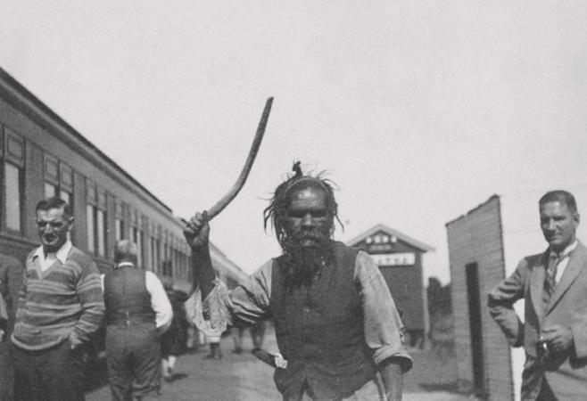 Trip to Melbourne on the Trans-Australia railway  unidentified Aboriginal man presents boomerang August 1919