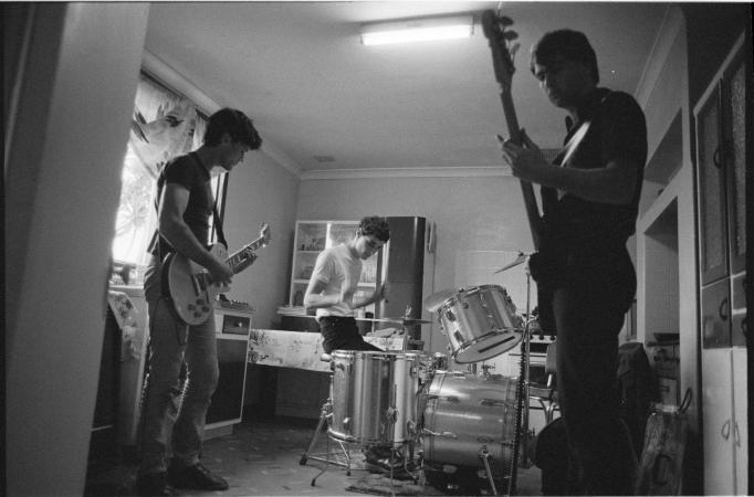 Confessions rehearse in a kitchen Fremantle Western Australia 1980
