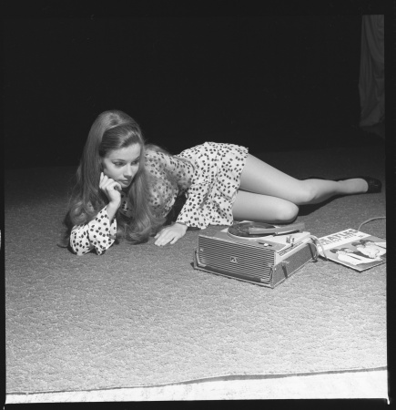  Teenager listening to The Beatles on a record player 1969