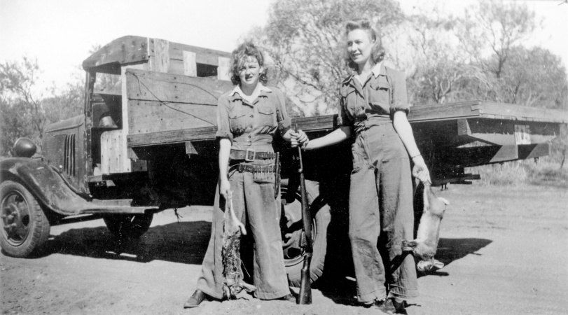 Rabbit shooters Northampton 1947 Two women posing beside a truck with guns and dead rabbits 