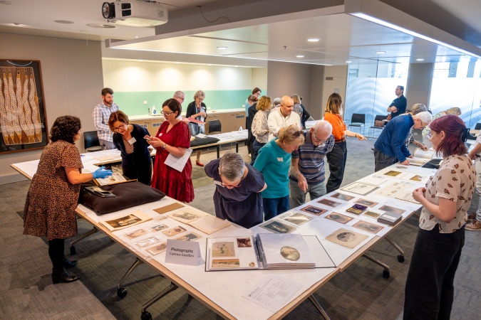 Members of the Turner family of Augusta at the State Library looking at collection items
