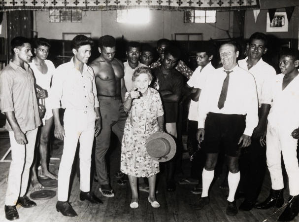 Effie Fellows in a gymnasium in Suva Fiji surrounded by young boxers and onlookers 1968