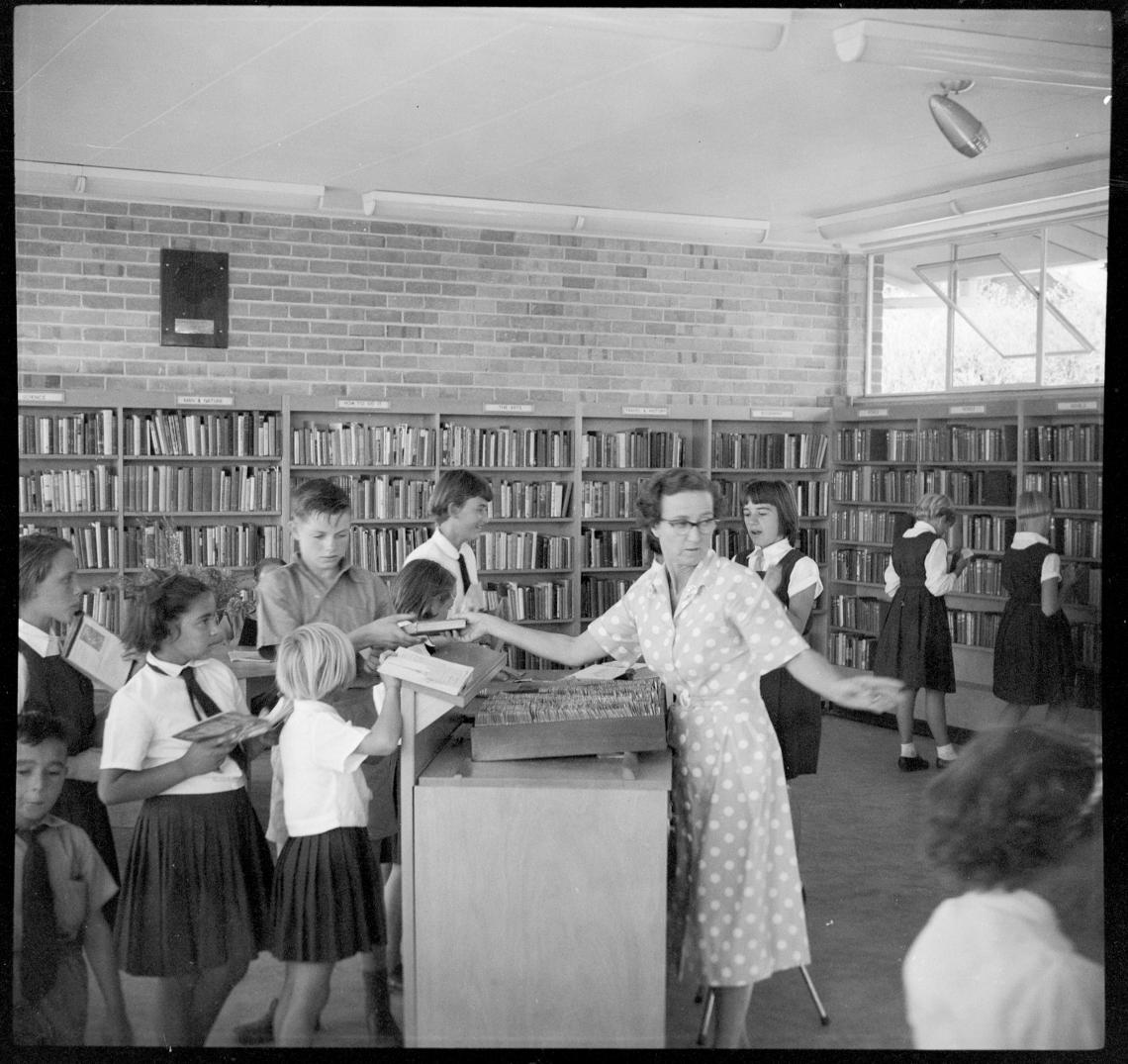 Librarian Patricia Morris lending out books at Kwinana Public Library 1959