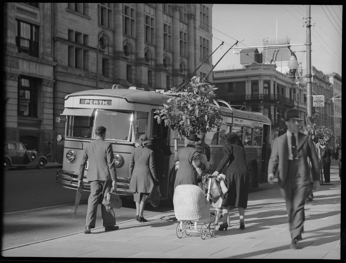 A trolley bus at a stop in St Georges Terrace c1950