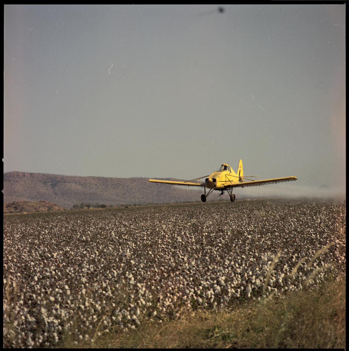Crop dusting Fossil Downs Station 1969