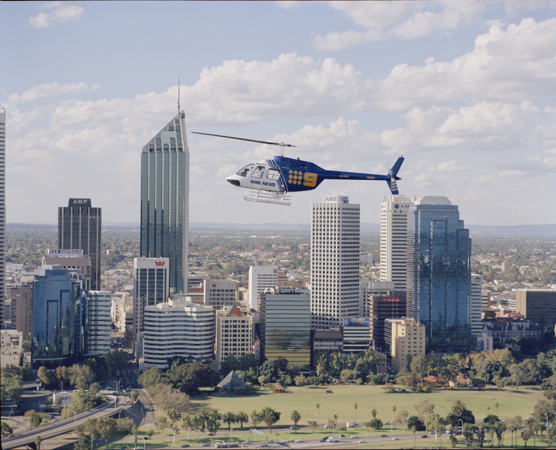 384912PD Channel Nine News helicopter flying over Perth 10 April 2000