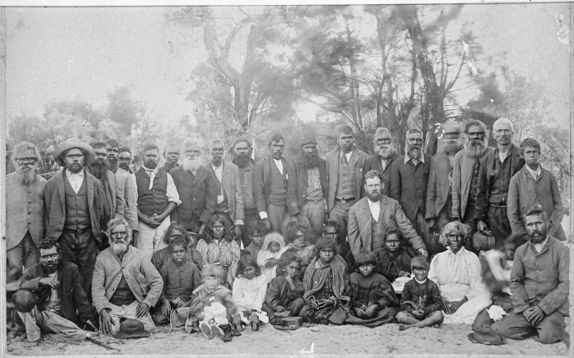 Group portrait of Noongar men women and children Fanny Balbuk sitting front row second from right Before 1907
