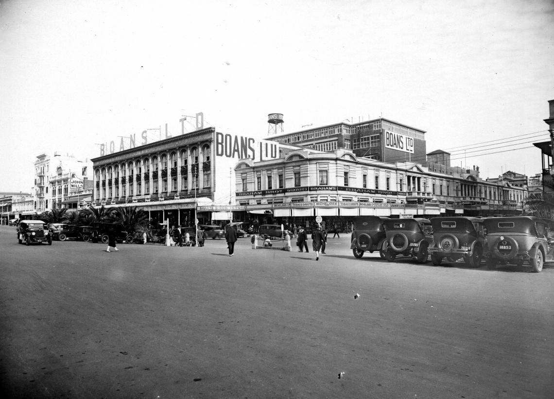 Across the forecourt of the Railway Station to the Padbury Buildings in Forrest Place and Boans Ltd in Wellington Street Perth ca1928
