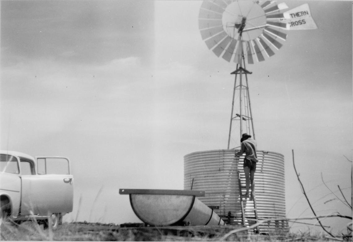 Erecting a new windmill and water tank on Rock Hill farm Wongan Hills home of John P Taggart and family ca 1960
