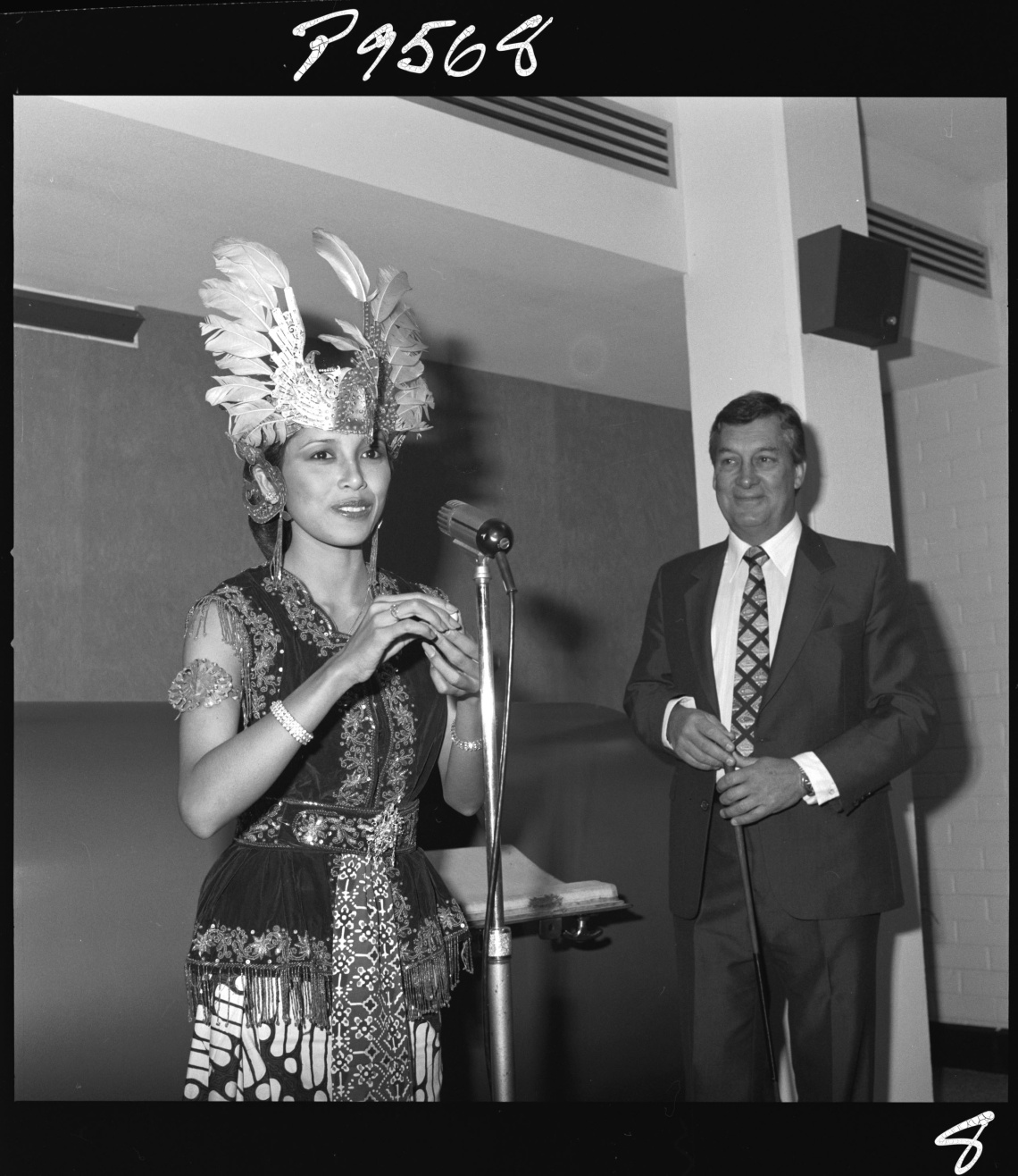 363275PD Miss Hartini in traditional Indonesian dress drawing the lottery numbers 198