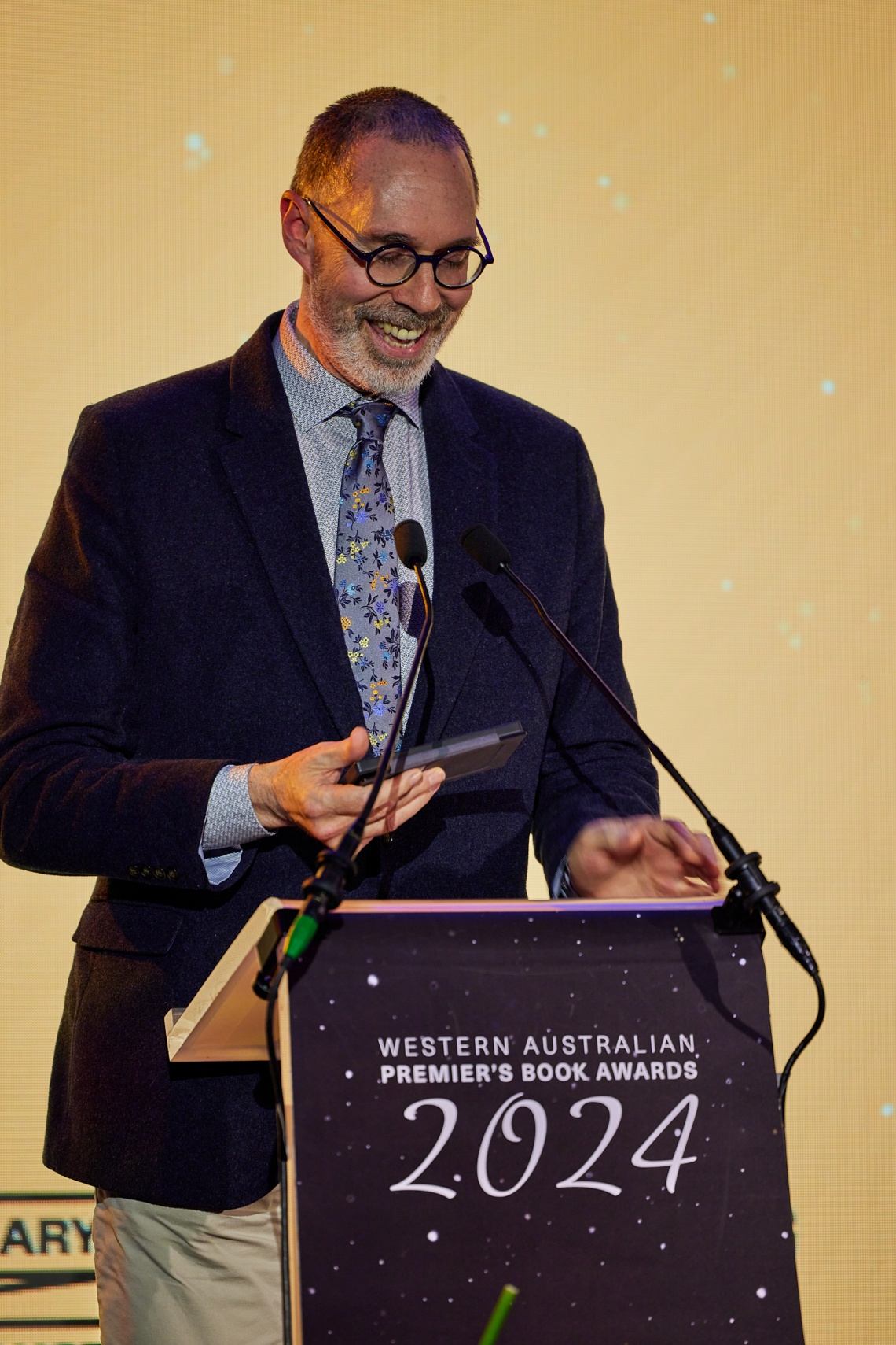 Will Yeoman CEO of Writing WA presenting an award