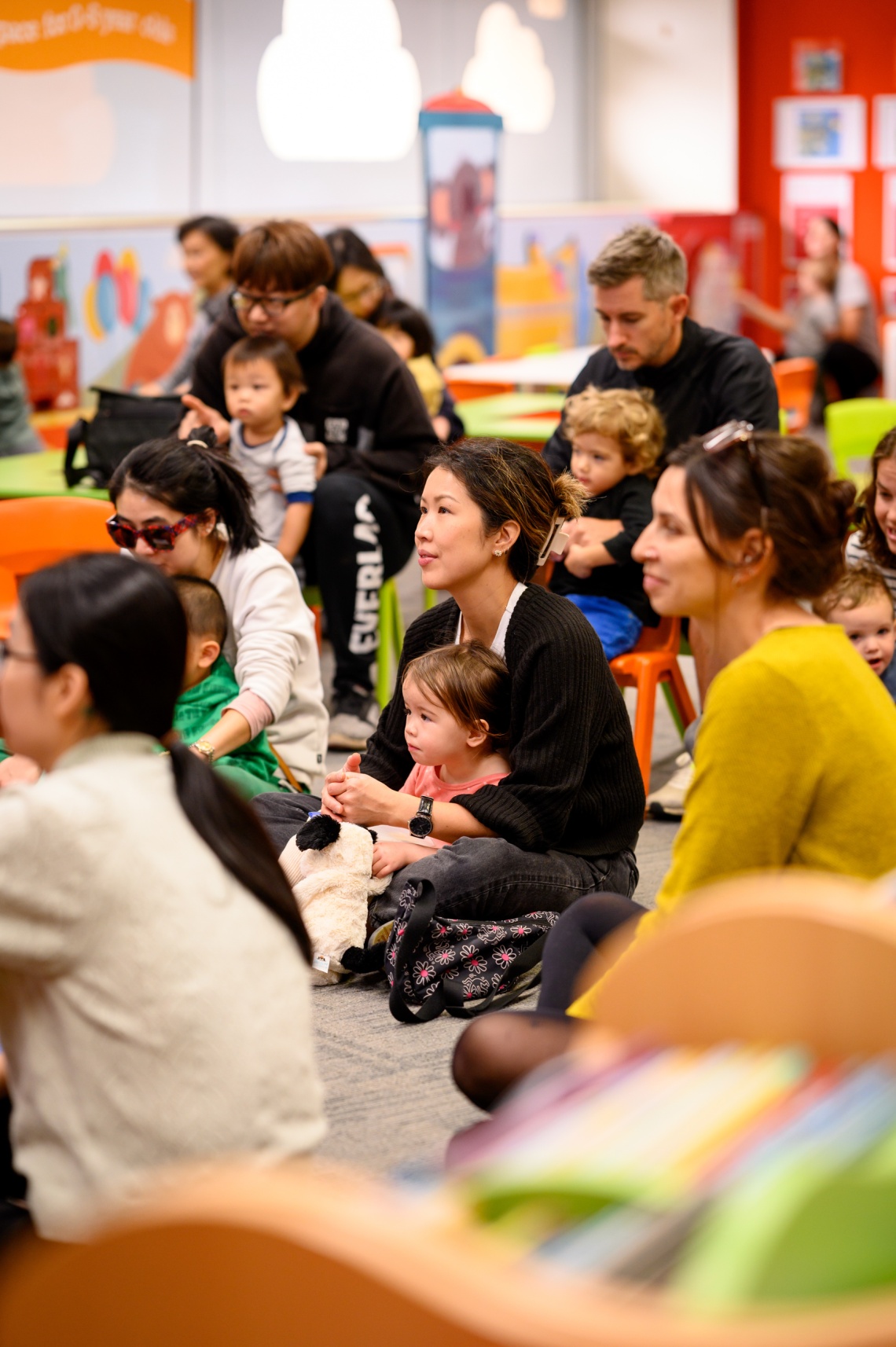 Parents and children listening Story Time