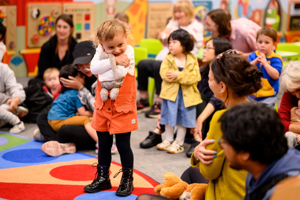 Story Time with child hugging toy