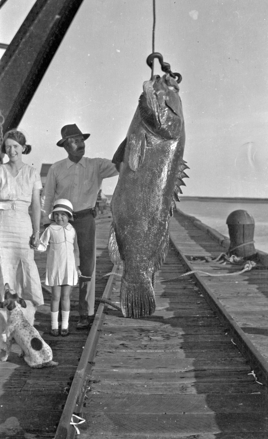 A family admire a big fish on Port Hedland Jetty 1934-1937