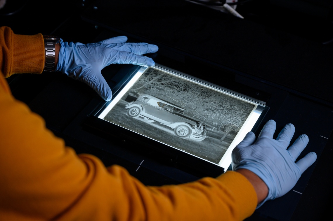 Scanning and digitising an old photograph negative in the preservation lab