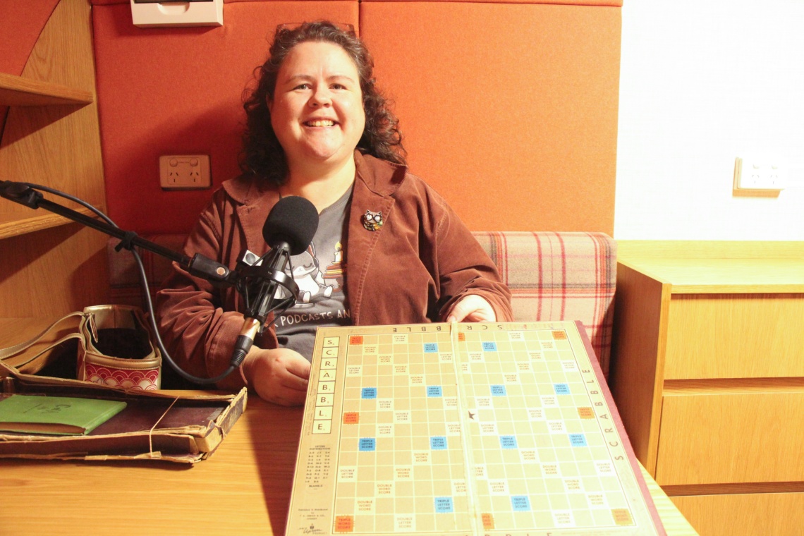 Amber Blake holding her familys Scrabble Board