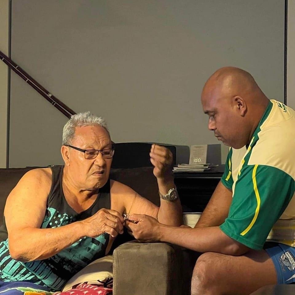 Fofo Poasa left and Himona Poasa right threading onto the Pa Hi Atu skip jack tuna fishing lure 